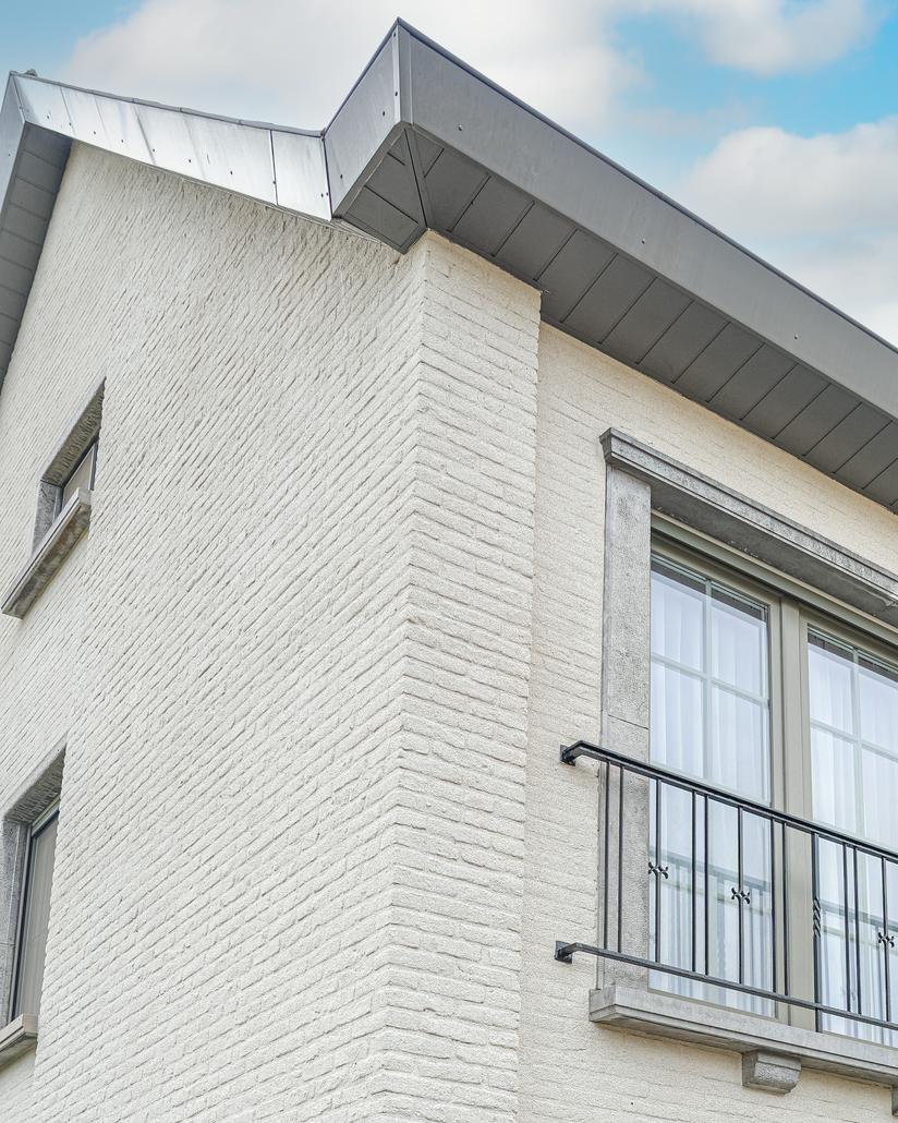 Gevelrenovatie met spuitkurk in Eeklo