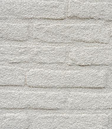 Gevelrenovatie met spuitkurk in Eeklo